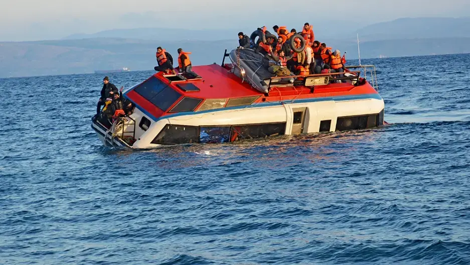A boat with refugees sinks off the coast of Lesbos near Sykaminia on October 30, 2015. Local residents and volunteers jumped into the sea to rescue them. All were safe. Image by Alison Terry-Evans. Greece, 2015. Media file: october30small.jpg