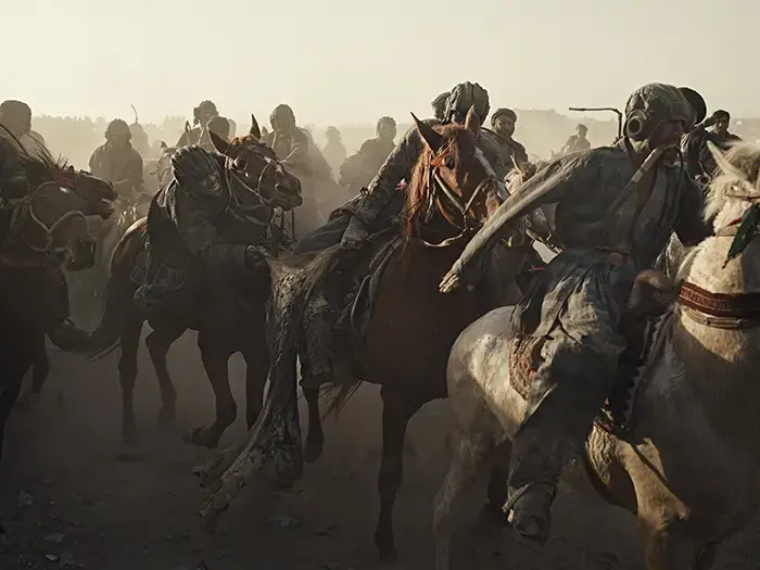 Riders battle for the calf at a buzkashi event in Balkh province, northern Afghanistan. Image by Balazs Gardi.