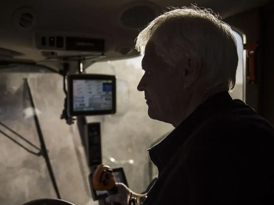Rick Kimberley, a fifth generation family farmer of rural Maxwell, combines soybeans on Tuesday, Oct. 17, 2017, in Polk County. The Kimberleys hosted Chinese President Xi Jingping on their farm when he visited Iowa in 2012. Image by Kelsey Kremer.