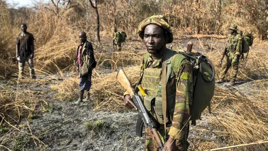 After days of pursuit, Chinko's rangers have caught two suspected poachers deep in the Chinko bush. A raid on a their camp uncovered shotguns, machetes and carcasses of antelope, buffalo, crocodile, hippo and monkey. Image by Jack Losh. Central African Republic, 2018. After days of pursuit, Chinko's rangers have caught two suspected poachers deep in the Chinko bush. A raid on a their camp uncovered shotguns, machetes and carcasses of antelope, buffalo, crocodile, hippo and monkey. Image by Jack Losh. Central African Republic, 2018.