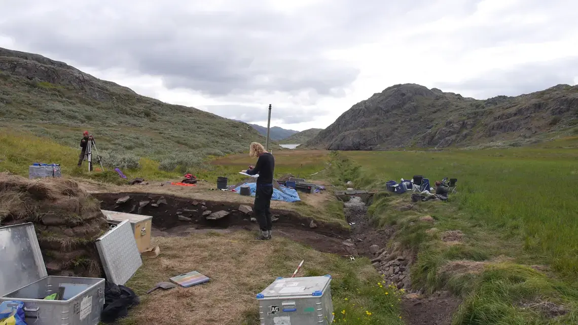 Archeologist Elie Pinta takes height measurements at an archeological dig in southern Greenland. The excavation, at a place, known today at Tasilikulooq, focuses on a site that once housed a small Norse dairy farm. Image by Eli Kintisch. Greenland, 2016. Archeologist Elie Pinta takes height measurements at an archeological dig in southern Greenland. The excavation, at a place, known today at Tasilikulooq, focuses on a site that once housed a small Norse dairy farm. Image by Eli Kintisch. Greenland, 2016.