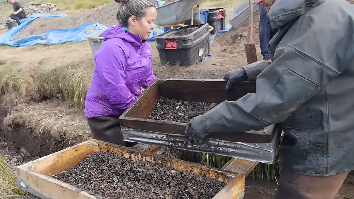 Greenlander Eva Luusi Marcussen-Mølgaard of the University of Greenland in Nuuk (left) washes soil off artifacts. She is one of a handful of students eager to study the archaeology of their homeland. Image by Eli Kintisch. Greenland, 2016. Greenlander Eva Luusi Marcussen-Mølgaard of the University of Greenland in Nuuk (left) washes soil off artifacts. She is one of a handful of students eager to study the archaeology of their homeland. Image by Eli Kintisch. Greenland, 2016.