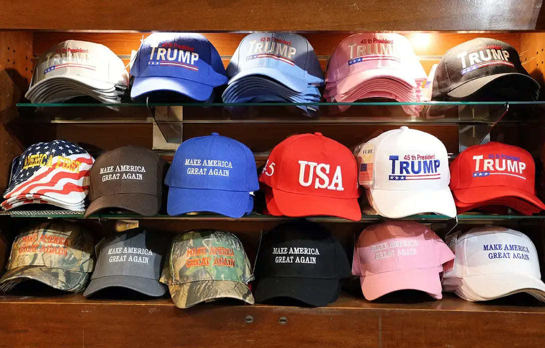 A selection of Donald Trump and Make America Great Again MAGA hats for sale in New York, NY on July 16, 2017. Image by Katherine Welles / Shutterstock.com. United States, 2017.
