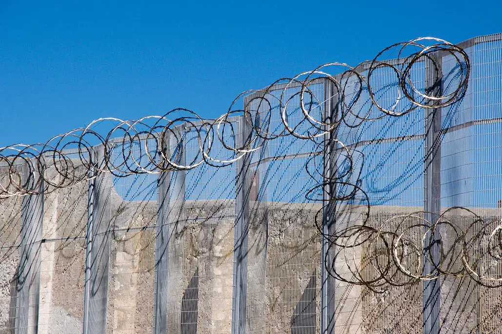 Razor wire fence at the Fremantle Prison in Fremantle, Western Australia. Image by Shutterstock. Australia, 2016. Razor wire fence at the Fremantle Prison in Fremantle, Western Australia. Image by Shutterstock. Australia, 2016.