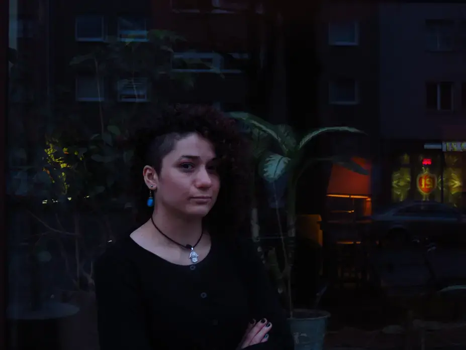 Roshak, a Kurdish-Syrian refugee, poses in front of a trendy cafe in Berlin's Kreuzberg neighborhood. Image by Laura Kasinof. Berlin, 2016. Roshak, a Kurdish-Syrian refugee, poses in front of a trendy cafe in Berlin's Kreuzberg neighborhood. Image by Laura Kasinof. Berlin, 2016.