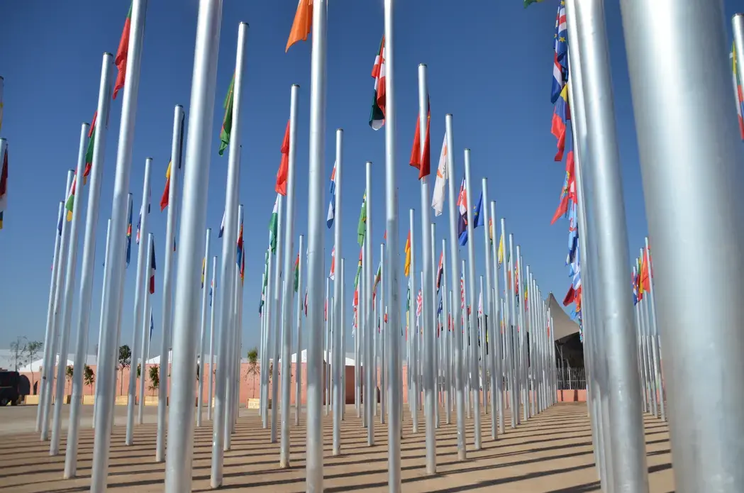 The flags of many nations fly at the COP22 climate conference in Marrakesh. The nearly 200 nations committed to the Paris Climate Agreement were stunned this week when President-elect Trump announced his plans to rush to withdraw from the accord. Image by Justin Catanoso. Morocco, 2016. The flags of many nations fly at the COP22 climate conference in Marrakesh. The nearly 200 nations committed to the Paris Climate Agreement were stunned this week when President elect Trump announced his plans to rush to withdraw from the accord. Image by Justin Catanoso. Morocco, 2016.