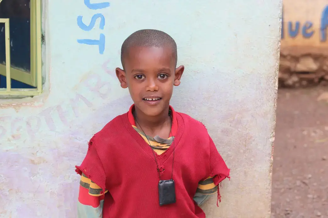 Natie Asnaunew poses for a photo at the day care center in Gondar Ethiopia. This day care center is run by Yenege Tesfa, Hope for Tomorrow, and it allows single mothers to drop their kids of everyday so they are able to go to work and help provide for their family. Image by Abigail Bekele. Ethiopia, 2018 Natie Asnaunew poses for a photo at the day care center in Gondar Ethiopia. This day care center is run by Yenege Tesfa, Hope for Tomorrow, and it allows single mothers to drop their kids of everyday so they are able to go to work and help provide for their family. Image by Abigail Bekele. Ethiopia, 2018