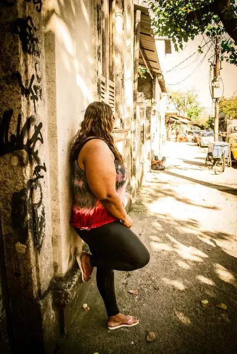 Carolina, a prostitute and community activist, stands on a street near to Vila Mimosa, Rio de Janeiro’s oldest and largest red-light district. Image by Lauren Wilks. Brazil, 2013. Media file: dsc_1708.jpg