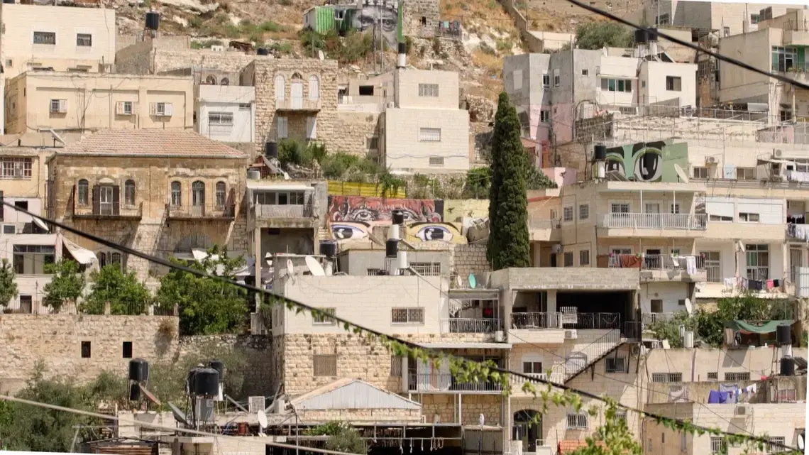 Murals of eyes look out from across the Wadi Hileh area in the Palestinian neighbourhood in Silwan. Image by BBC News Arabic. Murals of eyes look out from across the Wadi Hileh area in the Palestinian neighbourhood in Silwan. Image by BBC News Arabic.