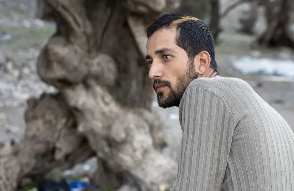 Mohab Alshocough, a 25-year-old actor from Damascus, Syria, at the Kara Tepe transit camp on the outskirts of the city of Mytiline on the Greek island of Lesbos, November 19, 2015. Image by Heidi Levine/The Intercept. Greece, 2015. Media file: mohab-alshocough.jpg