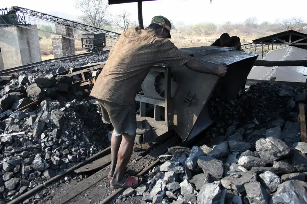 A worker at the Collum Coal Mine. Image by Eddie Mwanaleza. Zambia, 2013. Media file: coal_miner_in_zambia_chinese_mine-1.jpg