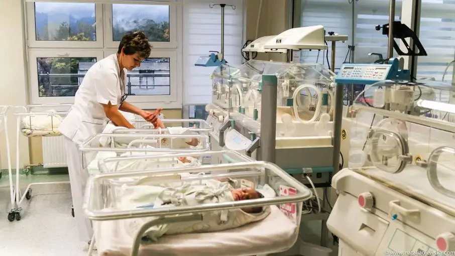 A midwife cares for a newborn baby at the Independent Public Health CAre Center in Myślenice, Poland. Image by Natalia Ojewska for The Texas Tribune. Poland, 2018. A midwife cares for a newborn baby at the Independent Public Health CAre Center in Myślenice, Poland. Image by Natalia Ojewska for The Texas Tribune. Poland, 2018.