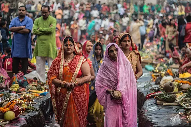People pray during Chhath, an ancient Hindu festival that gives gratitude to the sun god for sustaining life on Earth. Image by Yogendra Singh. India, 2018. People pray during Chhath, an ancient Hindu festival that gives gratitude to the sun god for sustaining life on Earth. Image by Yogendra Singh. India, 2018.