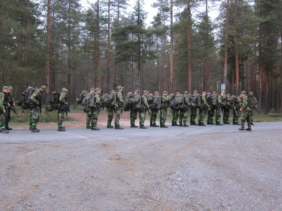 Swedish recruits prepare to step off on a hike. Image by Teresa Fazio. Sweden, 2018.