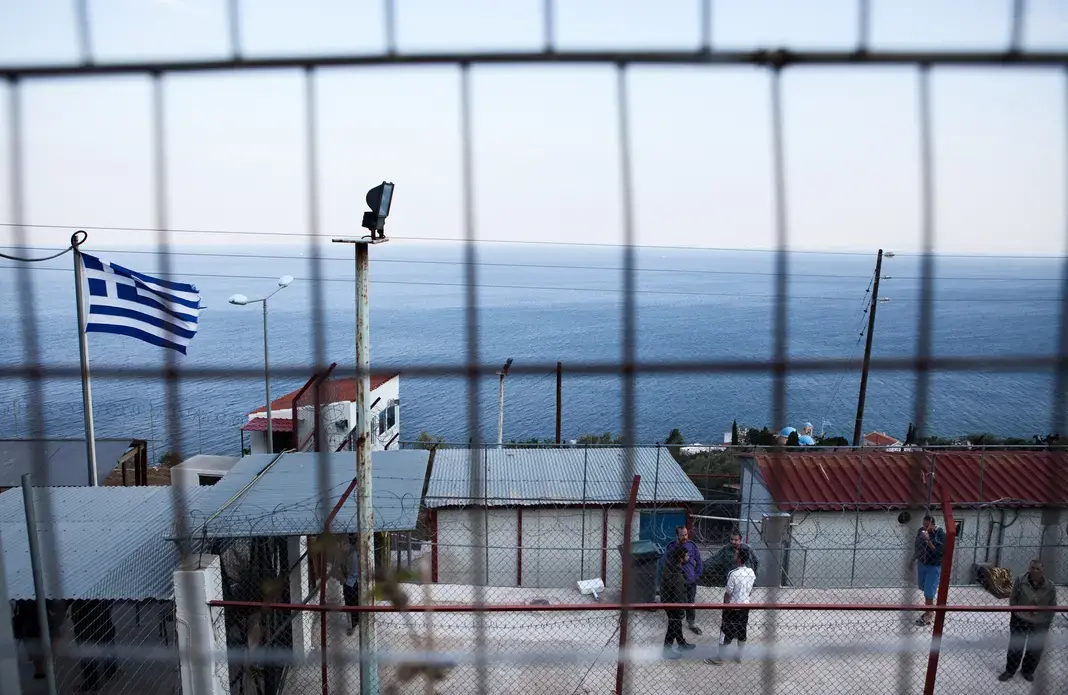 Police holding camp for undocumented migrants on Chios Island, Greece, Oct. 4, 2014. After the Coast Guard has processed new arrivals, Syrian asylum seekers will spend a few days, or sometimes longer, locked in this detention camp while the police complete the paperwork for a temporary stay in Greece. Image by Holly Pickett. Greece, 2014. Media file: hpchios009med.jpg