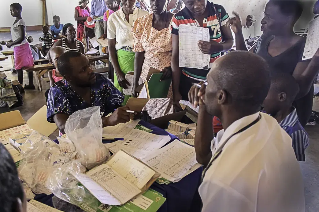 HIV-infected people in a remote Zimbabwean village receive antiretroviral drugs at the localchurch once every 2 months. Image by TJ Maposhere. Zimbabwe, 2015. Media file: img_9649.jpg