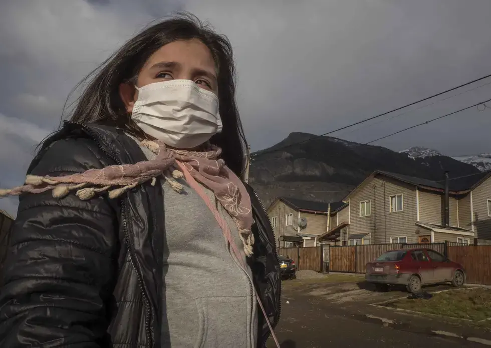 Natalie Galindo, 10, has severe asthma and most trips outside her home in the town of Coyhaique involve wearing a mask — or even a respirator. Image by Larry C. Price. Chile, 2018.
