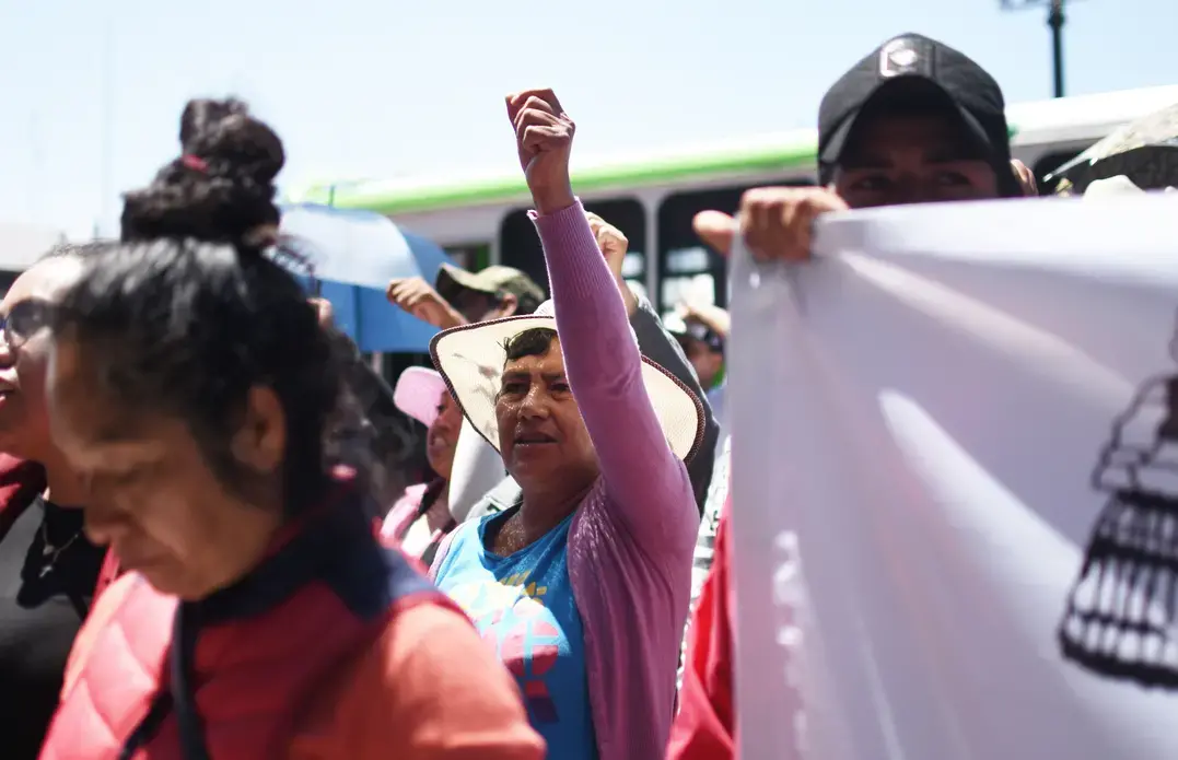 A woman raises her fist during a Mazahua Frente protest in Toluca. The advocacy group demanded to speak with the governor about their concerns. Image by Meg Vatterott. Mexico, 2018. A woman raises her fist during a Mazahua Frente protest in Toluca. The advocacy group demanded to speak with the governor about their concerns. Image by Meg Vatterott. Mexico, 2018.