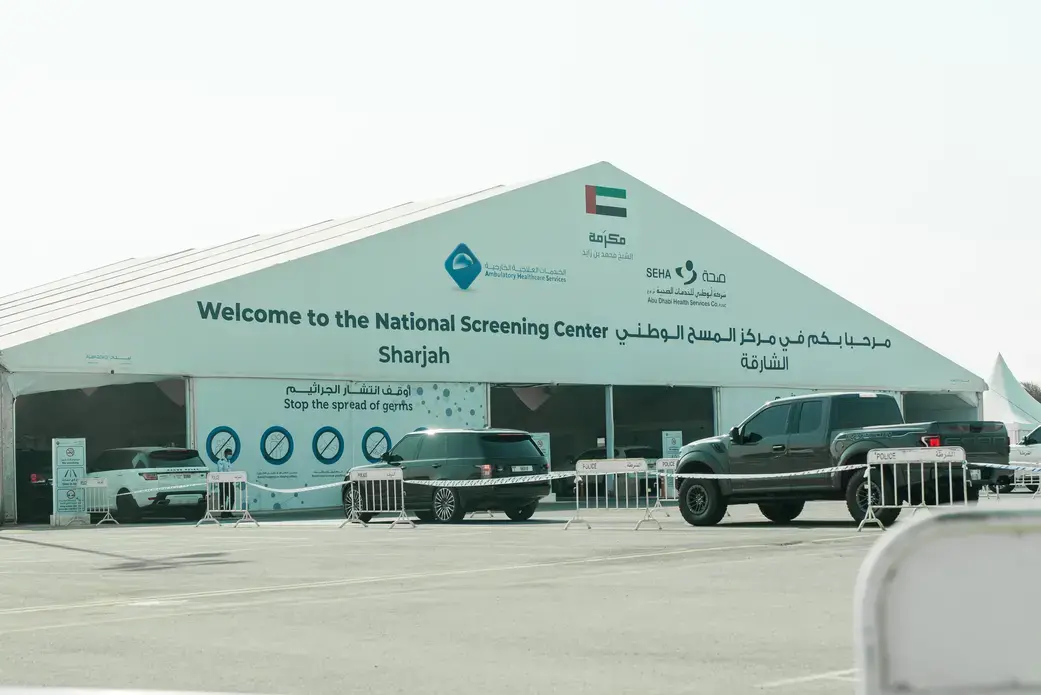 A drive-through screening center for COVID-19 in Sharjah. Image by Kateryna Galkina / Shutterstock. United Arab Emirates, 2020. A drive-through screening center for COVID-19 in Sharjah. Image by Kateryna Galkina / Shutterstock. United Arab Emirates, 2020.