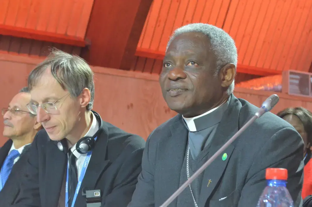 Cardinal Peter Turkson of Ghana, right, was Pope Francis' point man in charge of developing the research and writing "Laudato Si, On Care for Our Common Home." Image by Justin Catanoso. France, 2015. Media file: dsc_0204.jpg