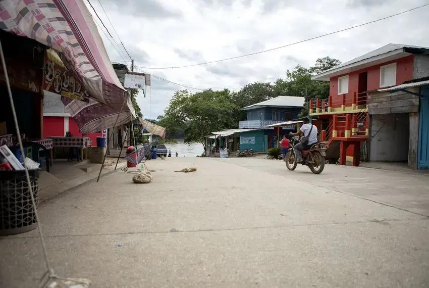 The main street in La Técnica, Guatemala, leads to a boat ramp on the Usumacinta River, which forms the international border with Mexico. Image by Miguel Gutierrez Jr. Guatemala, 2019.