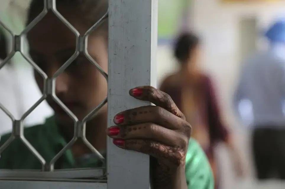 In this Thursday, Oct. 31, 2019, photo, a recovering tramadol user waits for her medication at a de-addiction center in Kapurthala, in the northern Indian state of Punjab. The pills were everywhere, as legitimate medication sold in pharmacies, but also illicit counterfeits hawked by itinerant peddlers and street vendors. India has twice the global average of illicit opiate consumption. Researchers estimate about 4 million Indians use heroin or other opioids, and a quarter of them live in the Punjab, India's agricultural heartland bordering Pakistan. Image by Channi Anand / AP Photo. India, 2019. In this Thursday, Oct. 31, 2019, photo, a recovering tramadol user waits for her medication at a de-addiction center in Kapurthala, in the northern Indian state of Punjab. The pills were everywhere, as legitimate medication sold in pharmacies, but also illicit counterfeits hawked by itinerant peddlers and street vendors. India has twice the global average of illicit opiate consumption. Researchers estimate about 4 million Indians use heroin or other opioids, and a quarter of them live in the Punjab, India…
