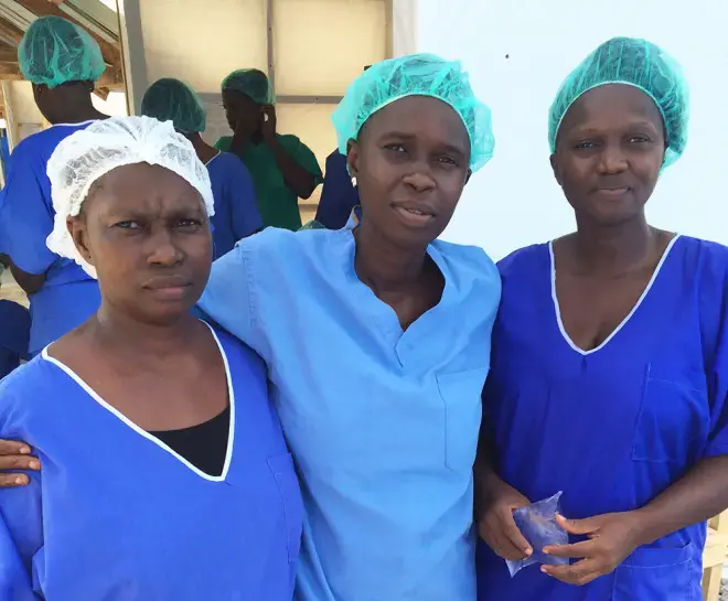 From left, nurses Zainab Fofanah, Kanko Marah, Mariatu Kargbo at the Magbenteh treatment center. Image by Erika Check Hayden. Sierra Leone, 2014. Media file: ebola-nurses-inline-660x545.jpg