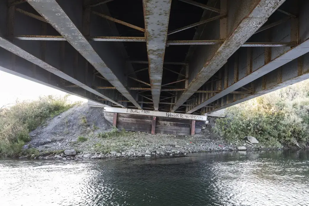 Thawing permafrost has caused a tilt on the pilings that support this bridge on the Nome-Teller Highway, requiring increased maintenance as the Northwest Alaska climate warms. Image by Steve Ringman. United States, 2019. Thawing permafrost has caused a tilt on the pilings that support this bridge on the Nome-Teller Highway, requiring increased maintenance as the Northwest Alaska climate warms. Image by Steve Ringman. United States, 2019.