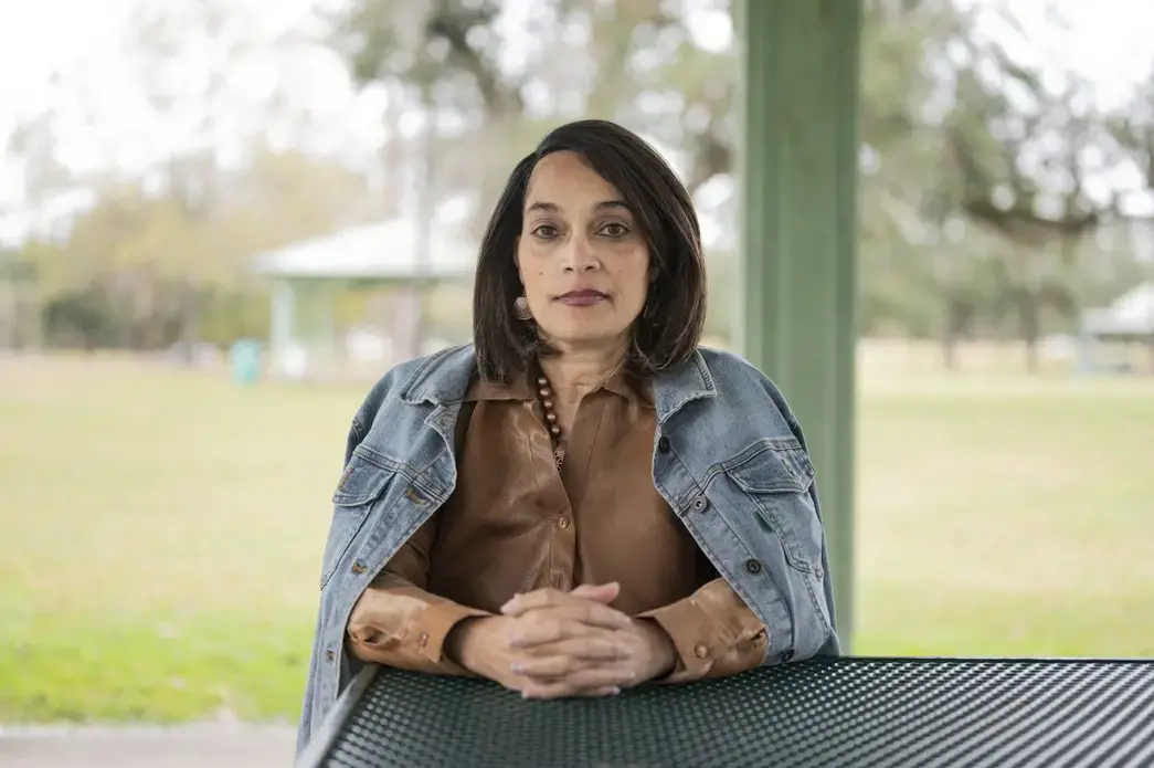 Dr. Lisa Morgan at Girard Park near where she is staying after her home in Lake Charles was damaged during back-to-back hurricanes in August and October. Image by Katie Sikora. United States, 2020. Dr. Lisa Morgan at Girard Park near where she is staying after her home in Lake Charles was damaged during back-to-back hurricanes in August and October. Image by Katie Sikora. United States, 2020.