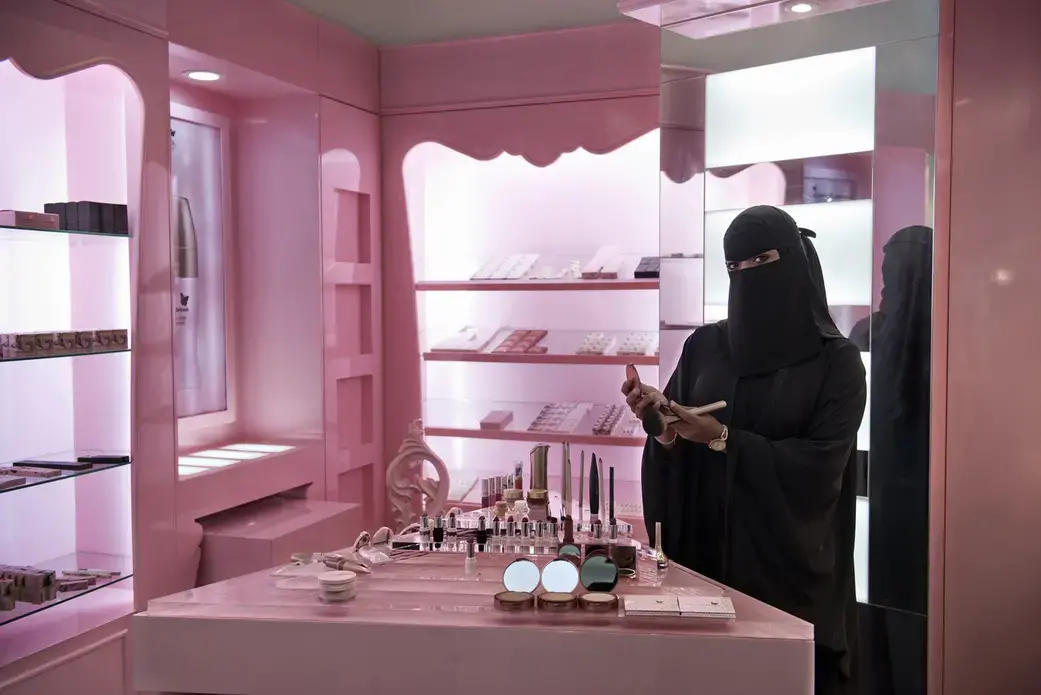 It took a decree from King Abdullah, in 2011, to put tens of thousands of women into the workforce. For the first time, they are interacting daily with men who are not family members, as cashiers in supermarkets and as salesclerks selling abayas and cosmetics and underwear. Image by Kate Brooks. Saudi Arabia, 2013. Media file: zoepf_saudiwomen0005.jpg
