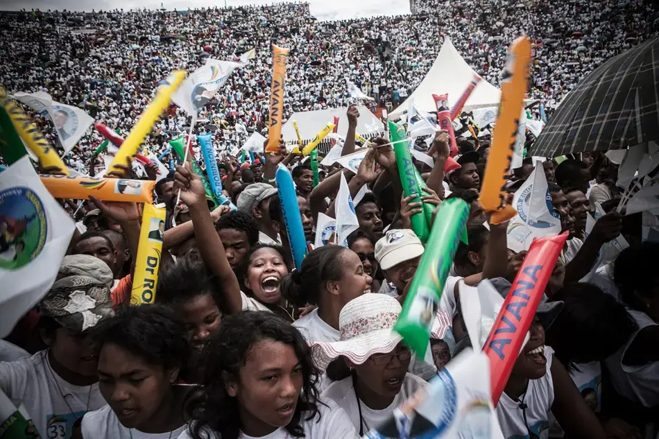 Supporters of presidential candidate Jean Louis Robinson cheer at the candidate's last rally before the December 20 runoff. Image by Rijasolo / Riva Press. Madagascar, 2013. Media file: robinson_crowd.jpg