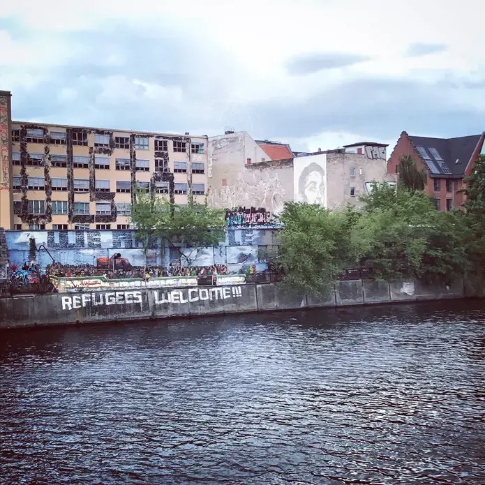 "Refugees Welcome" reads graffiti in one part of Berlin, Germany, the country that took in the most asylum seekers during the 2015 refugee crisis. Image by Alice Su. Germany, 2017.