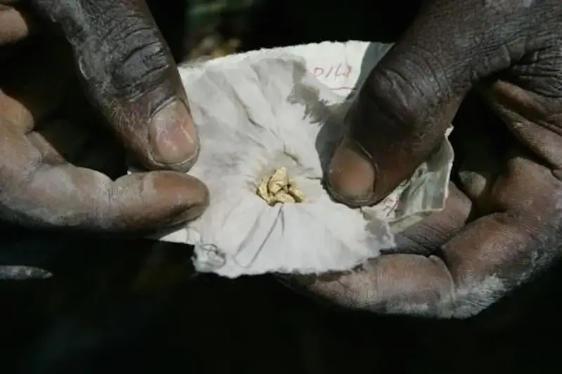 A miner shows off a piece of gold. Image by Carlos Villalon. Democratic Republic of Congo, 2006. A miner shows off a piece of gold. Image by Carlos Villalon. Democratic Republic of Congo, 2006.