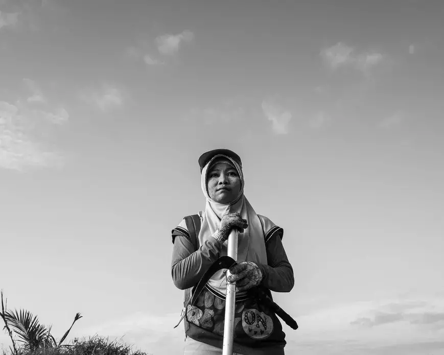 Supraetun at the plantation. Image by Xyza Cruz Bacani. Indonesia, 2018. Supraetun at the plantation. Image by Xyza Cruz Bacani. Indonesia, 2018.