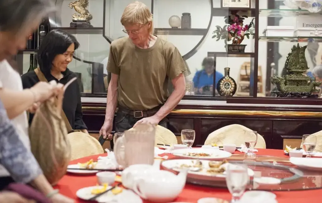 Sally Kwan and Duane Hanson finish dinner with Sally's family in Chinatown, Manhattan, on May 19, 2019. Image by Michael G. Seamans. United States, 2019.