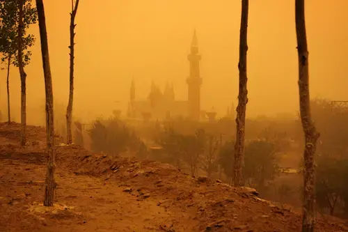 A sandstorm encapsulates a mock castle in the desert tourist park of Shapotou in Ningxia Province. The park is situated on the edges of the Tengger desert hence is regularly bombarded by sandstorms. 1