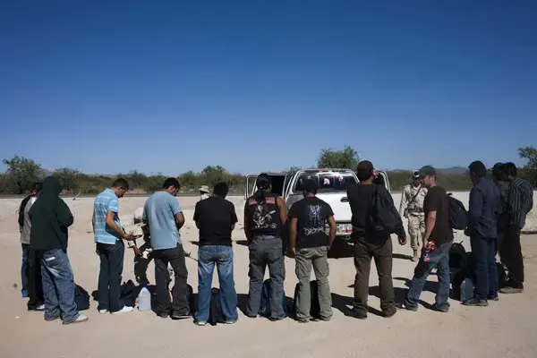 A group of migrants are stopped and searched by the Mexican army near Sasabe, Sonora. 1