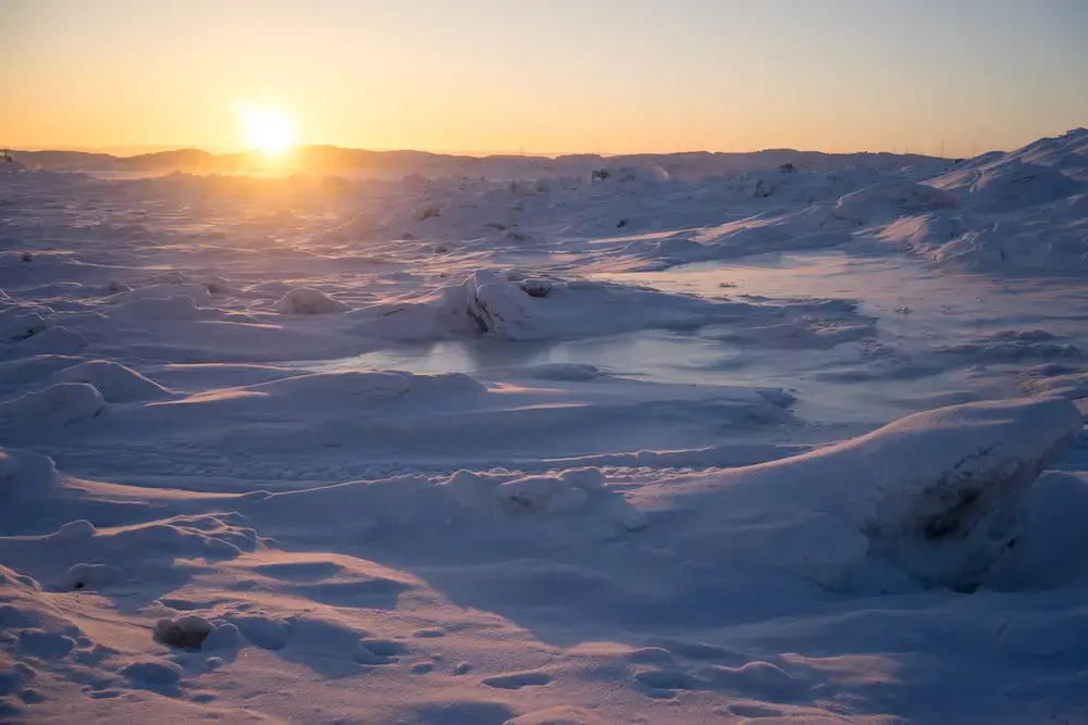 The winters are long and dark in Nunavut. The return of the sun is a celebration. Image by Nick Mott. Canada, 2018.