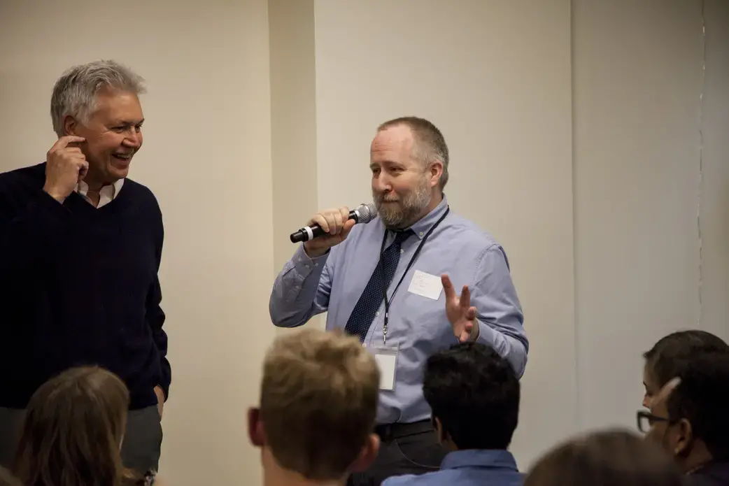 Pulitzer Center Executive Director Jon Sawyer and Communications Director Jeff Barrus talk to student fellows. Image by Jin Ding. United States, 2018.