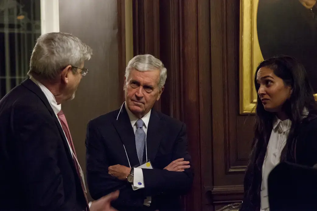 Pulitzer Center Senior Editor Tom Hundley talks with William Bush of the Board of Directors; and Meghan Dhaliwal, photojournalist and student fellow alumni. Image by Jin Ding. United States, 2018.