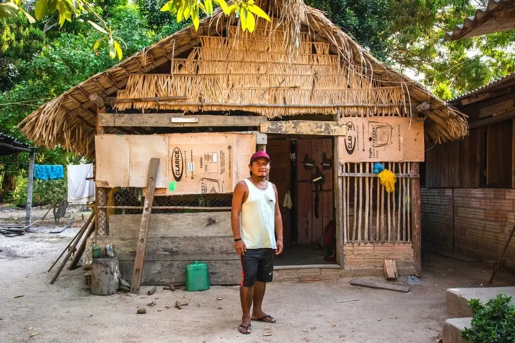 Man photographed in front of his hut in Munduruku territory.