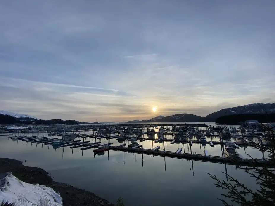 A harbor with mountains in background.
