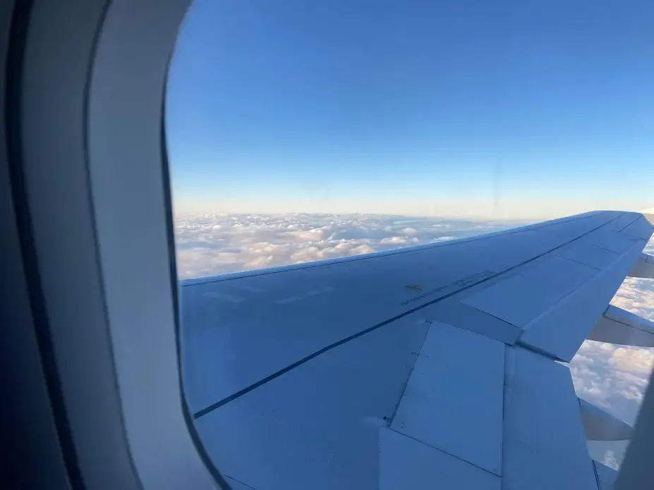 View of a plane wing from a cabin window.