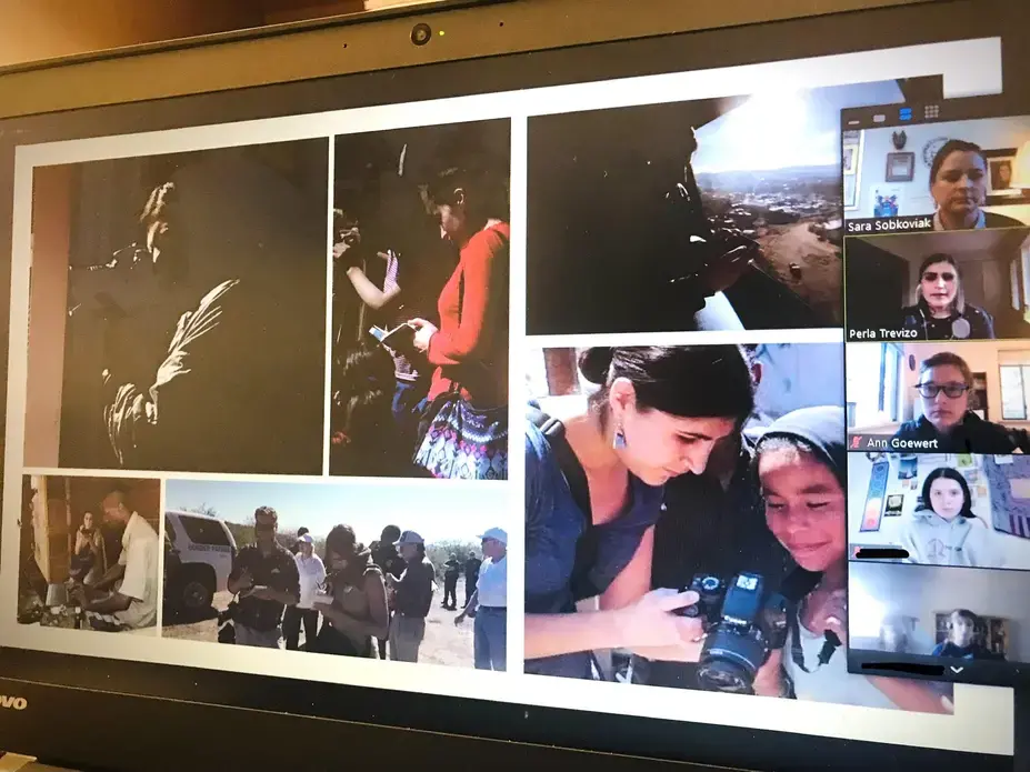 A journalist presents photos of herself in the field to a group of high school students via Zoom.
