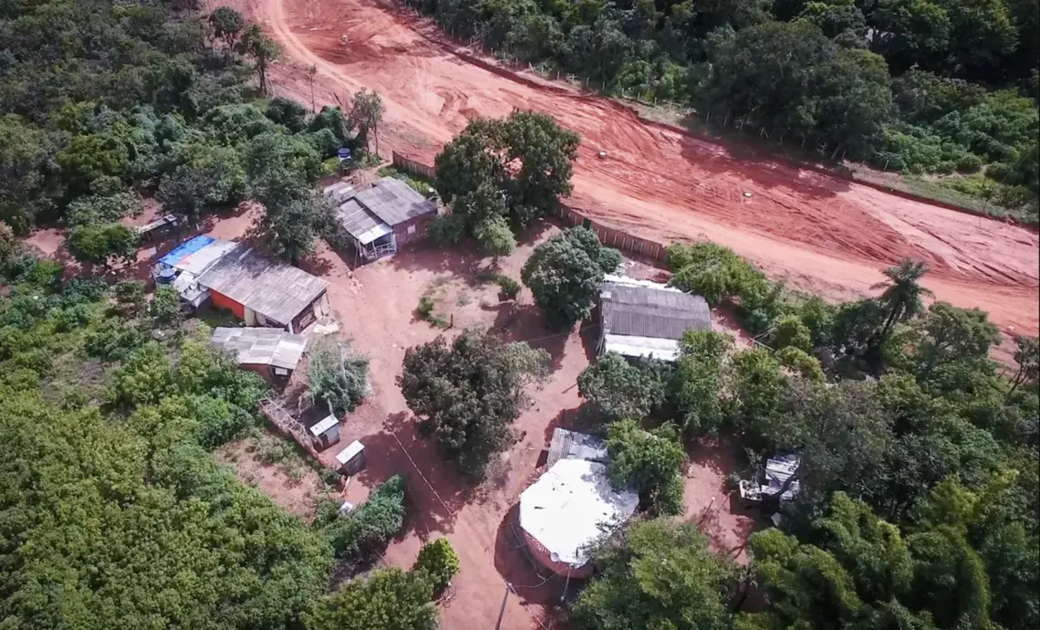 Aerial view of buildings in a forested area.