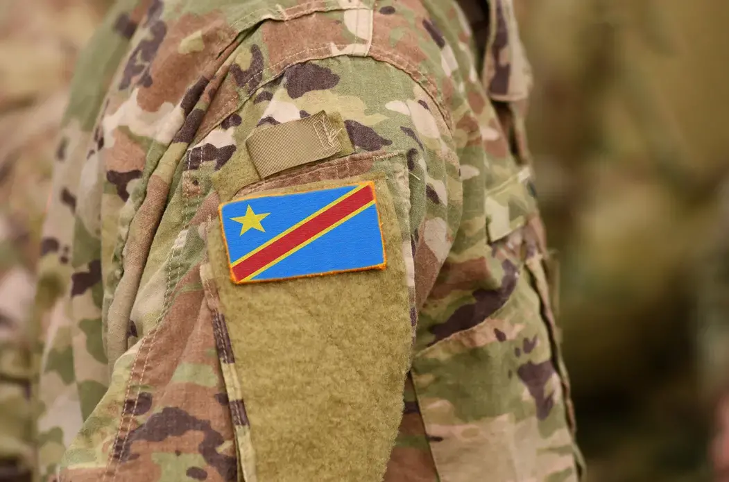 Democratic Republic of the Congo flag on soldiers arm. Democratic Republic of the Congo troops