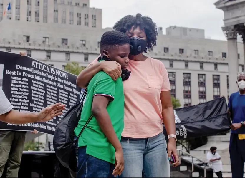 Image of a mother and son at protest