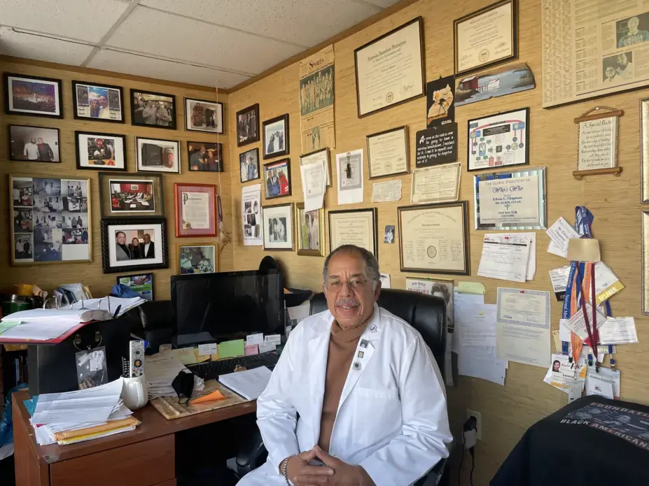 Chapman sitting in office.png Dr. Edwin Champan