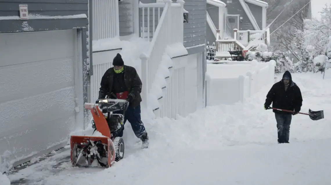 Screen-Shot-2021-11-11-at-55458-PM.png two people plowing snow