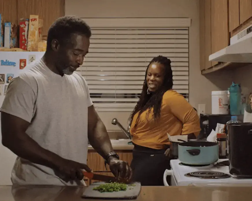 Screen Shot 2022-05-02 at 11.44.49 AM.png Man chops while wife leans against counter watching
